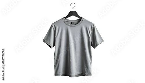 Plain gray t-shirt hanging from a black hanger against a black background