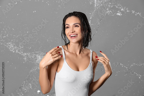 Happy young woman with wate...
