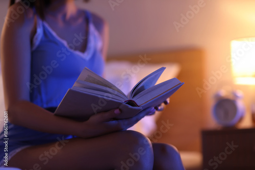 Young woman reading book an...