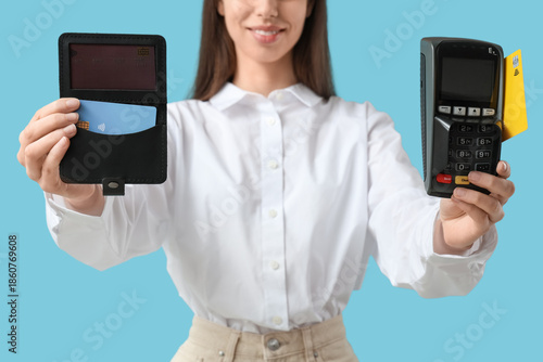 Young woman holding credit ...