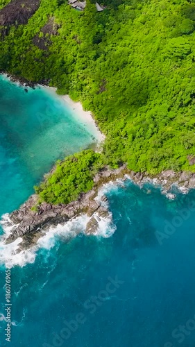 Wallpaper Mural Green vegetation along a rocky coastline with white sand beaches. Seychelles, Mahe. Butzel Beach. Torontodigital.ca