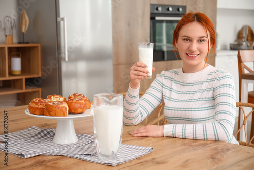 Young redhead woman with gl...