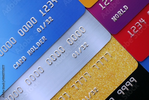 Many credit or debit cards with fictional specimen numbers. Big amount of banking plastic cards of various colors. Financial concept of business and e-commerce