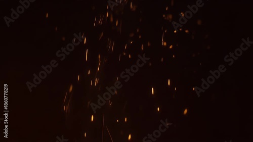 Warm orange abstract fire embers rising slowly in dark void. Elegant serene light particles