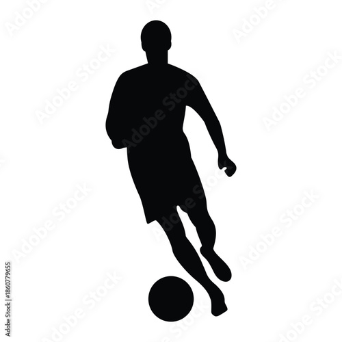 Black silhouette of a soccer player kicking a ball
