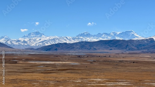 Panoramic view of Mount Everest and the Himalayan mountain range seen from Nyalam in Shigatse, Tibet, featuring vast highland plains and snowcapped peaks in a remote Asian landscape.