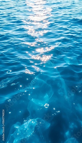 Shimmering ice blue water with gentle ripples and soft light reflection,  water surface,  surface