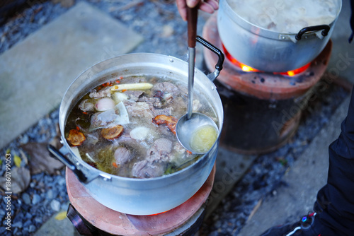Beef soup in a pot on a hot stove Street food, Thailand.