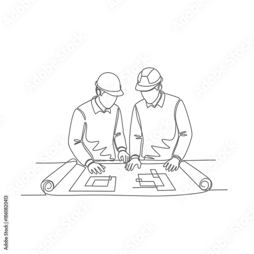 Two engineers reviewing architectural blueprint.