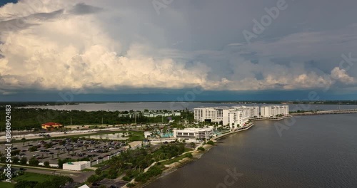 Wallpaper Mural Dark hurricane clouds rolling over a tourist resort complex on the bay shore. Severe stormy weather approaching coastal destination Torontodigital.ca