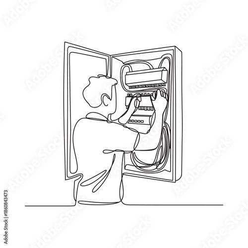 A technician works inside an electrical panel maintaining power distribution systems