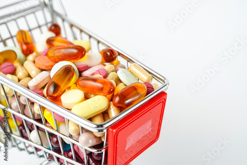 Shopping cart full of medicines, pills, drugs, vitamins, health shopping concept