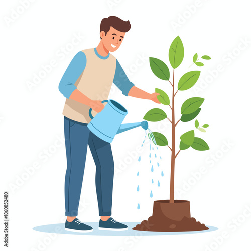 Man watering a young plant in a garden from a front viewpoint