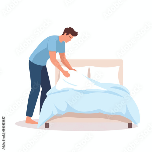 Man making bed in bedroom with blue sheets and white pillows