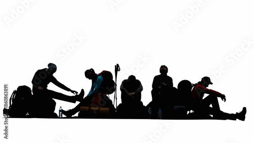 Group of hikers resting with backpacks during a break.