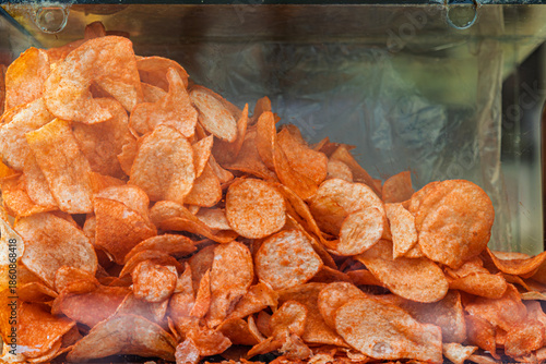 Close up on seasoned potato chips in a street vendor display case in Toluca, Mexico
