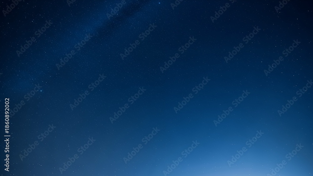 Obraz premium Clear Night Sky Filled with Sparkling Stars and Subtle Milky Way Galaxy Glow