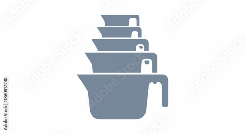 Stack of gray measuring cups with handles on a white background viewed from the front