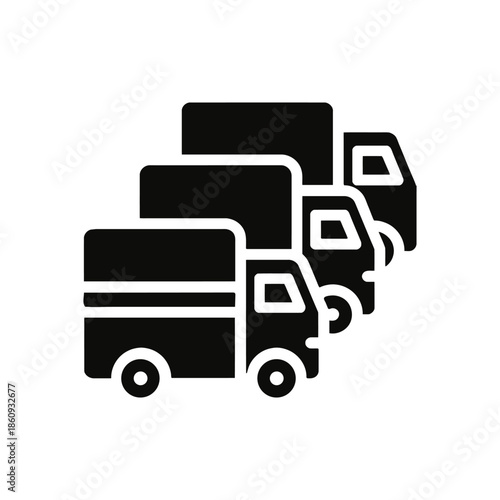 a group of trucks driving on a road