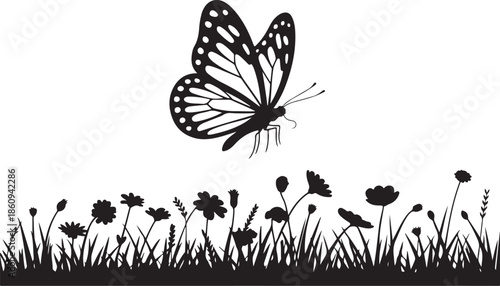 Black butterfly flying over wildflowers in a field