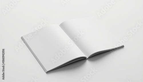 Landscape magazine mockup in a modern and clean mood with blank cover slightly angled on a smooth white surface and sharp studio lighting