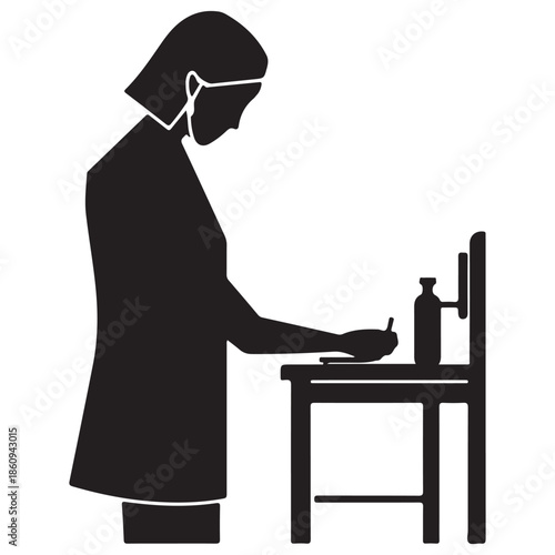  Individual practicing hygiene at a station with a face mask and hand sanitizer