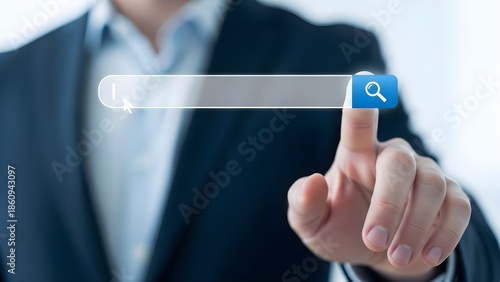 Close-up of a businessman's index finger clicking a blue search icon on a transparent screen with a blurred background.