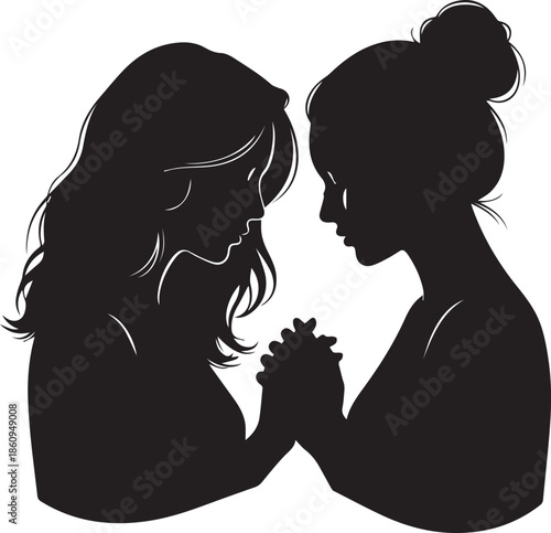 Silhouette of two women holding hands and praying together