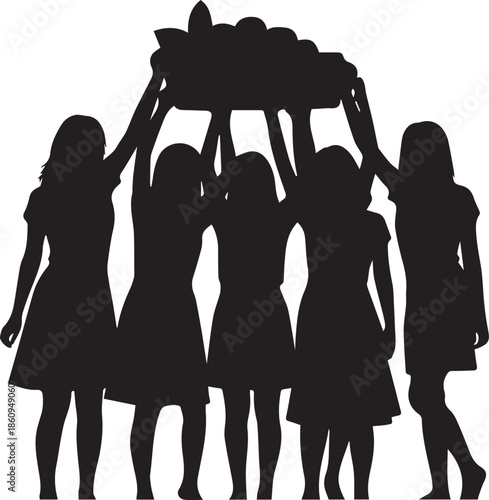 Group of girls holding a treasure chest above their heads in silhouette
