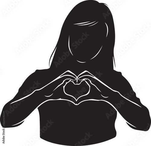 Silhouette of a person making a heart shape with hands
