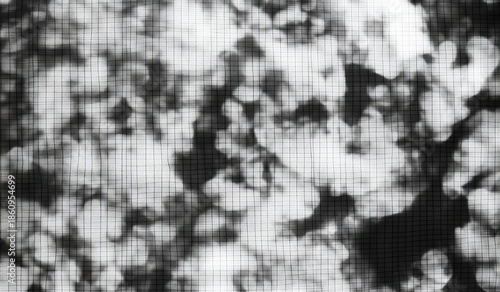 Abstract grayscale image of textured spots and grids