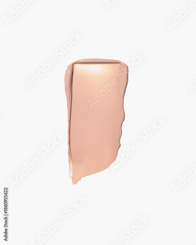 Smooth beige foundation smear for flawless makeup look