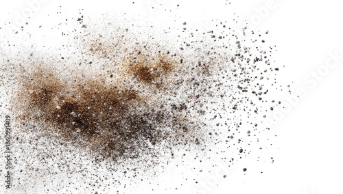 Splatter of dirt and dust particles against a white backdrop