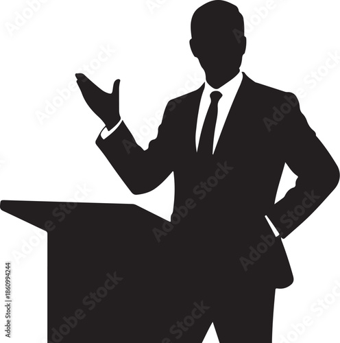 Silhouette of a man in a suit speaking at a podium
