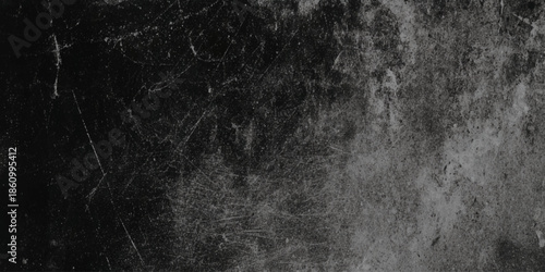 A textured black and white abstract background with grainy details and subtle variations in tone is shown