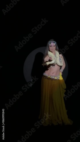 Exotic Dancer with Albino Python in Spotlight Performance