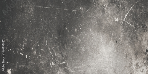 A heavily textured monochrome background with scratches spots and subtle tonal variations creates an abstract effect