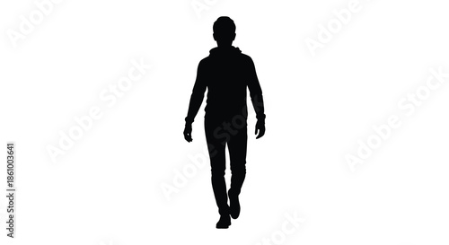 A solitary figure walking forward depicted as a striking black shape silhouette