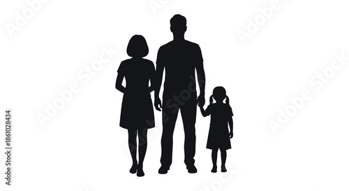 A family of three stands together a mother father and daughter in silhouette