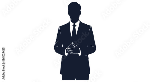A formal business professional stands with hands clasped presenting a confident and poised silhouette