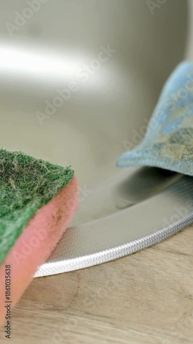 Close up of used sponge rag in the kitchen at home equipment for the household cleaning at home dirt on the surface vertical.