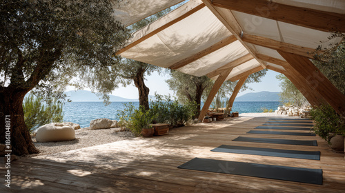 Outdoor yoga area with wooden planks, linen fabric roof, and scenic seaside view with trees and rocks