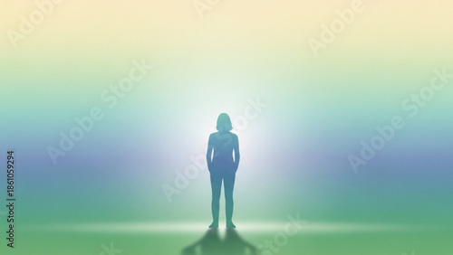 Silhouette of a woman standing alone in a bright colorful background with a gradient