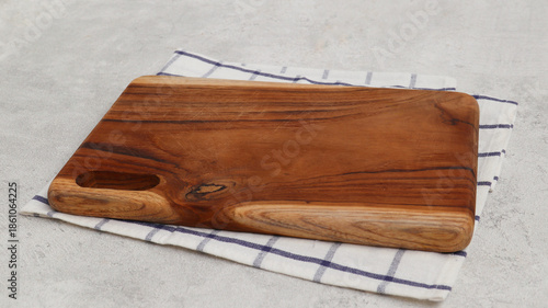 Wooden cutting board isolated on grey background