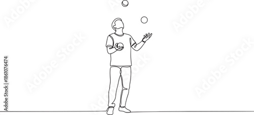 Man juggling balls in dynamic motion with playful expression