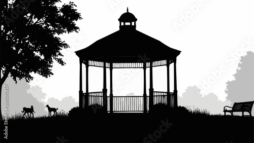 Silhouette of a classic gazebo in a park with trees and a bench.