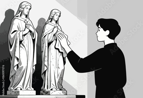 A person cleans two religious statues, one holding a cross