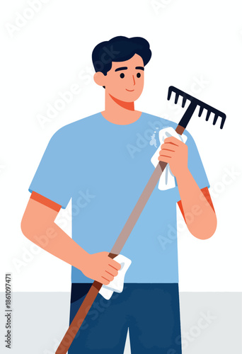 Man cleaning a rake with a cloth