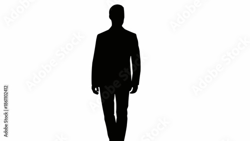 Silhouette of a man in a suit walking forward.