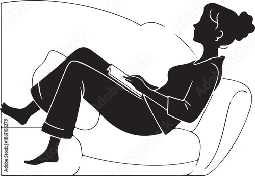 Black silhouette of woman relaxing and reading on comfortable sofa.